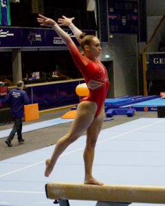 Breanna Scott competing on beam